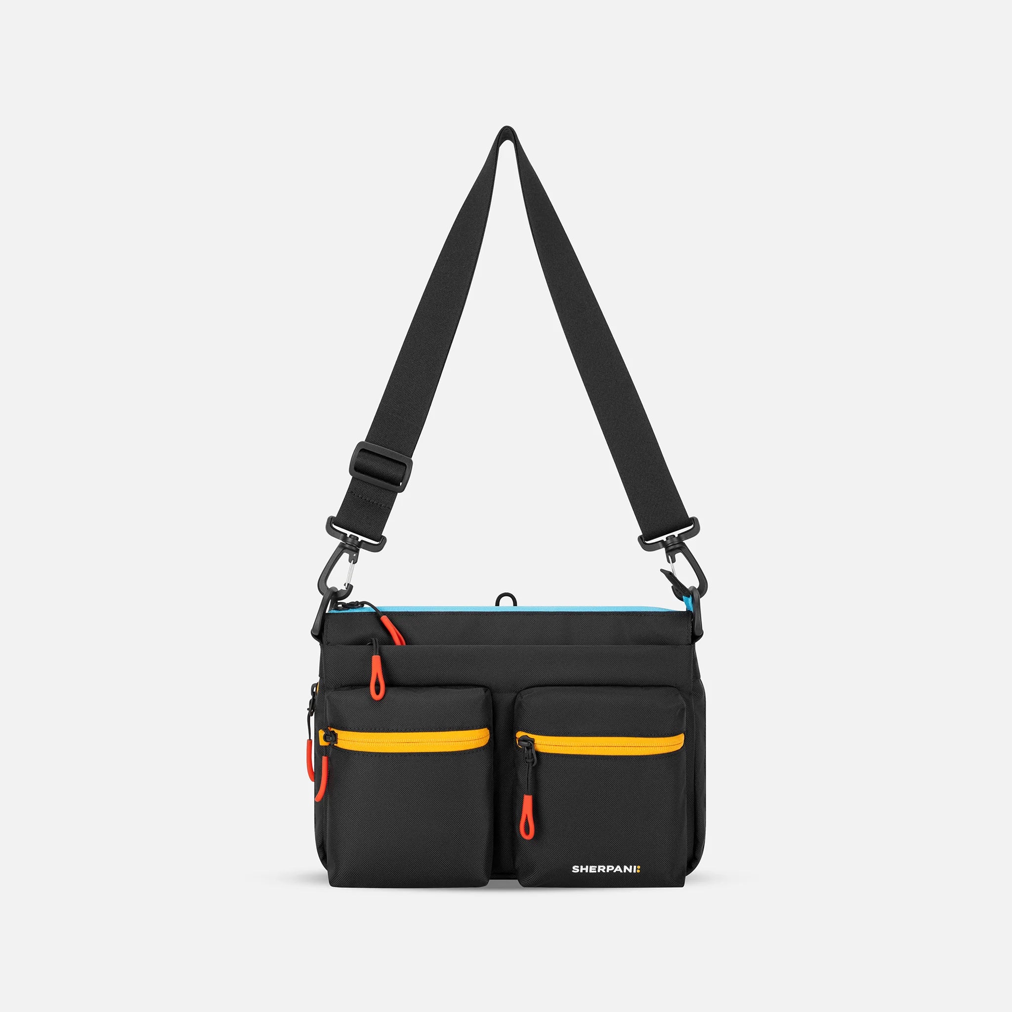 A Sherpani Ceara Chromatic Black Expandable Crossbody, front view showing two front pockets and adjustable strap on a white background. #color_chromatic-black