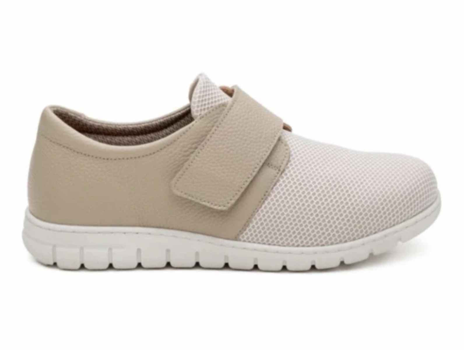 Lateral side profile view of Soft Mode Gwen 6654-15 women's cream extra-wide 3E shoe with stretch fabric and a Velcro strap.