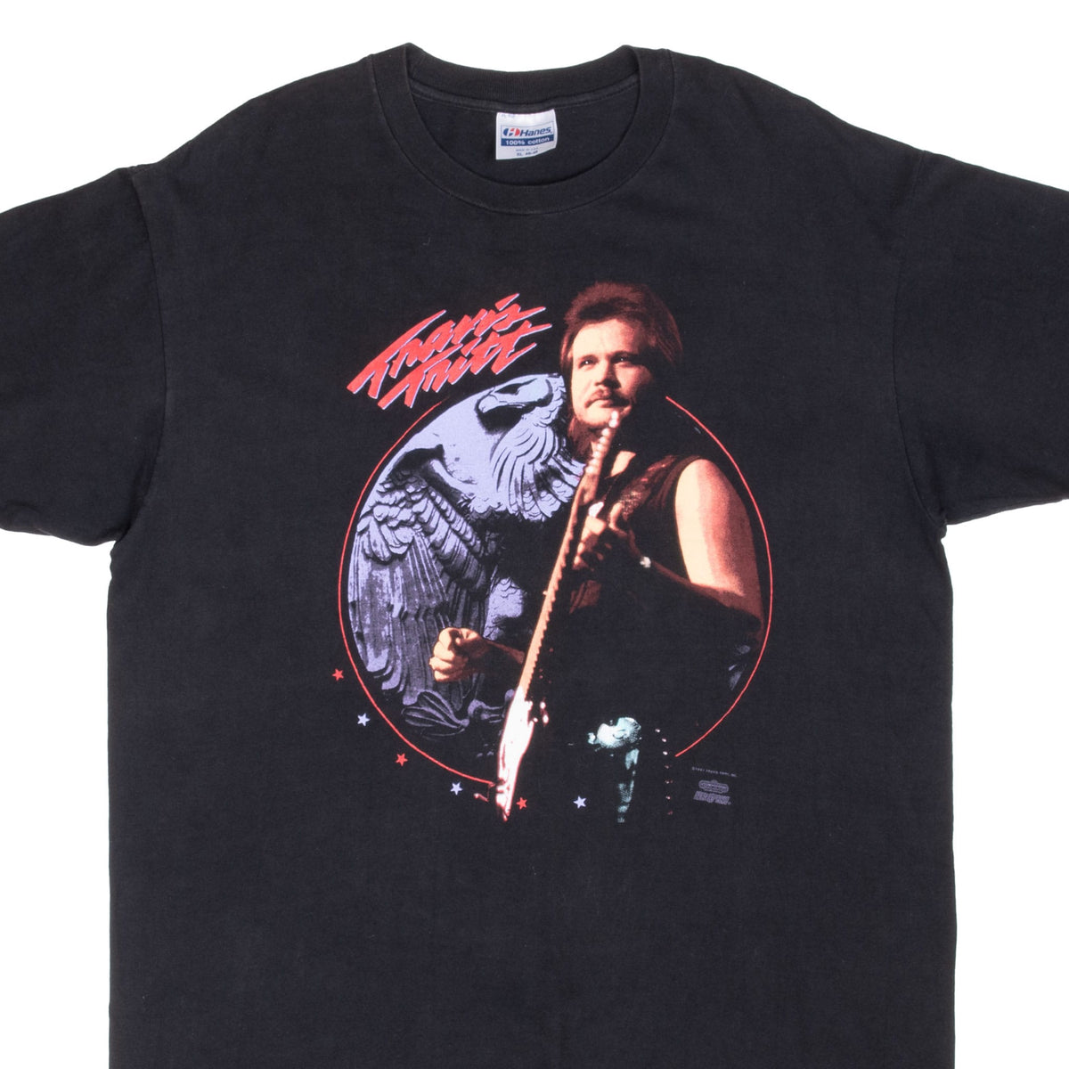 Front of black Travis Tritt T-shirt with portrait, eagle and star graphic