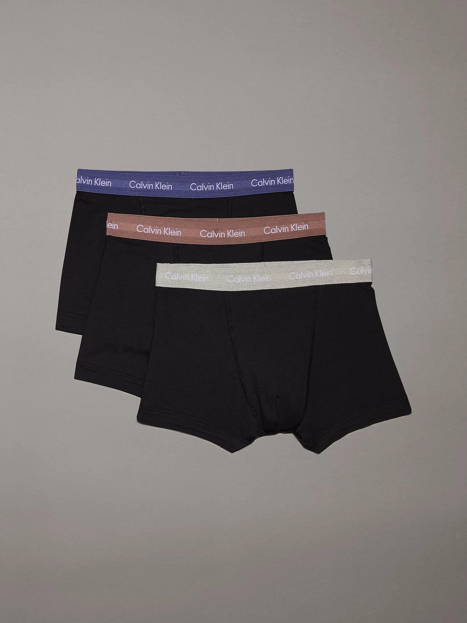 Calvin Klein COTTON STRETCH Mens 3 Pack Trunks Black front view showing three pairs with black trunks and various waistband colors.