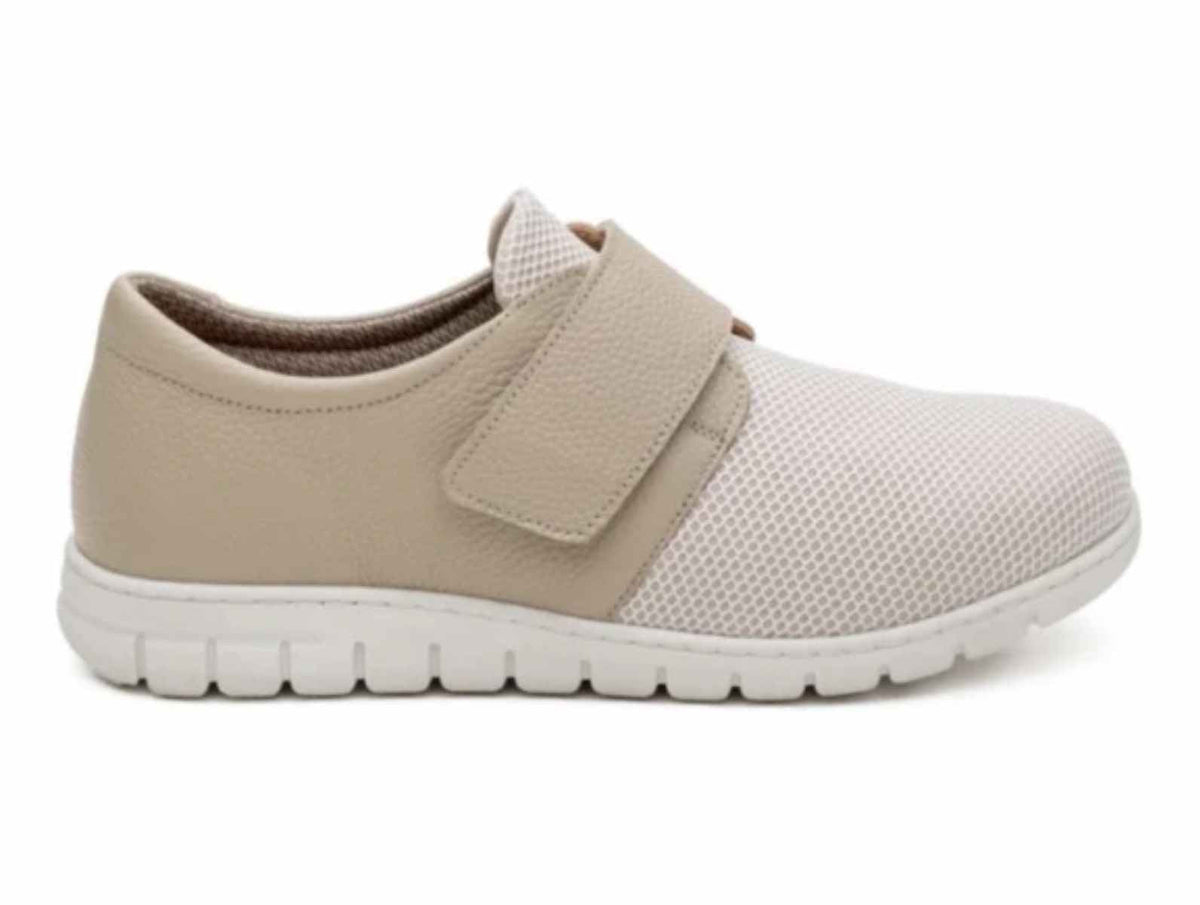 Lateral side profile view of Soft Mode Gwen 6654-15 women's cream extra-wide 3E shoe with stretch fabric and a Velcro strap.