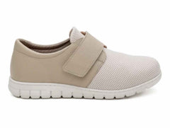 Lateral side profile view of Soft Mode Gwen 6654-15 women's cream extra-wide 3E shoe with stretch fabric and a Velcro strap.